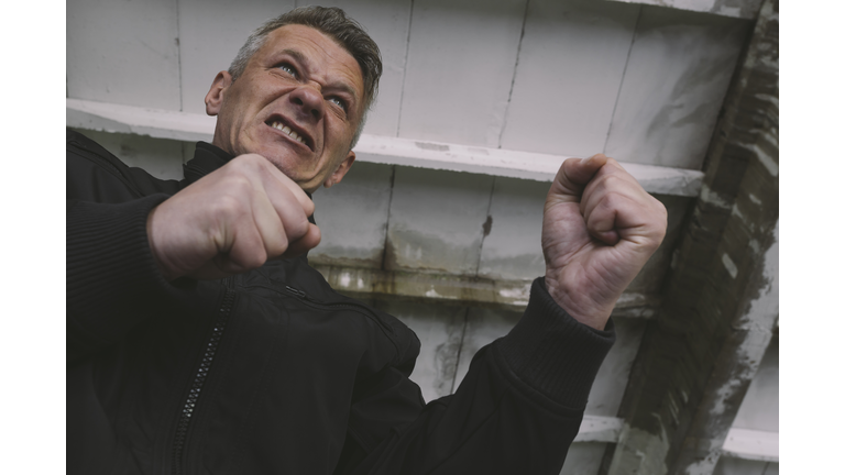 Outraged, furious man ready to fist fight