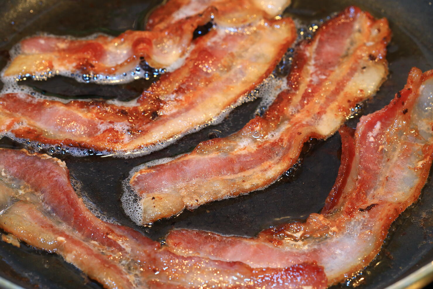 Sizzling Bacon in the frying pan