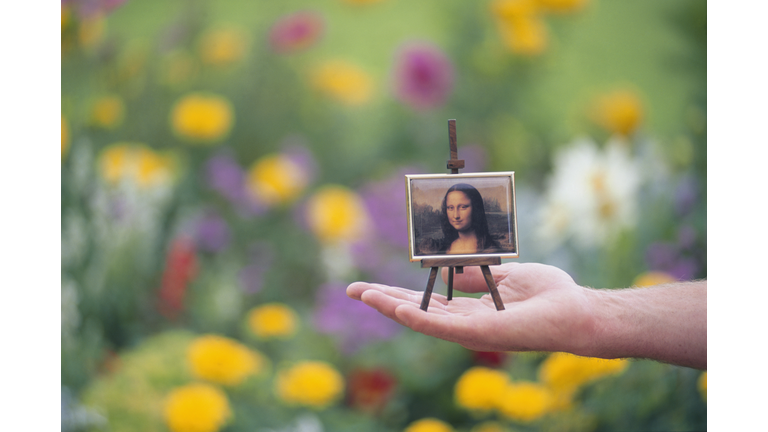 Person with Mona Lisa Picture