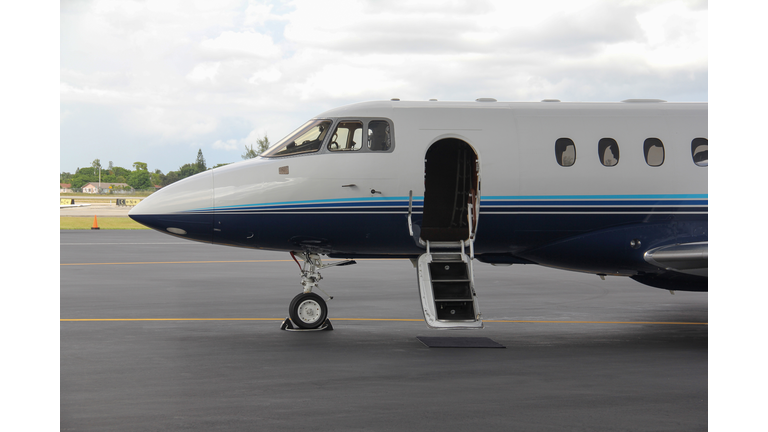 Private jet parked at terminal