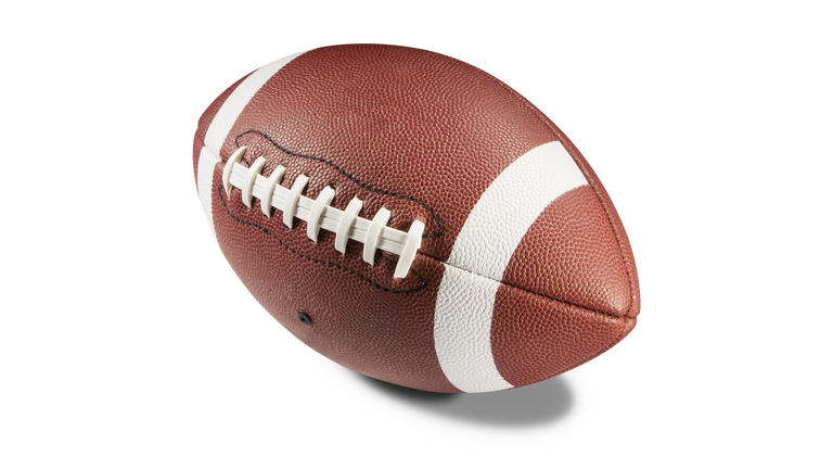 Brown and white American football on white background