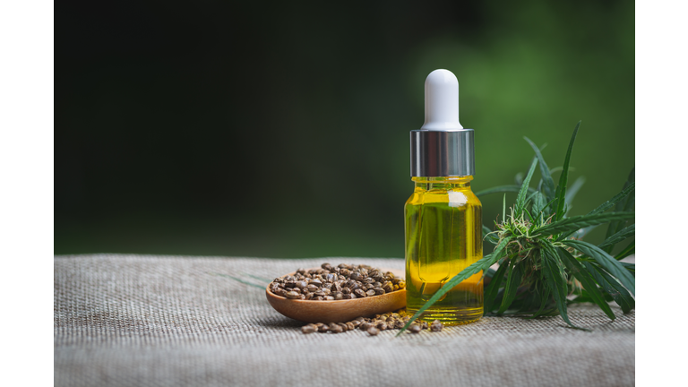 CBD oil hemp products, Medicinal cannabis with extract oil in a bottle. Medical cannabis concept