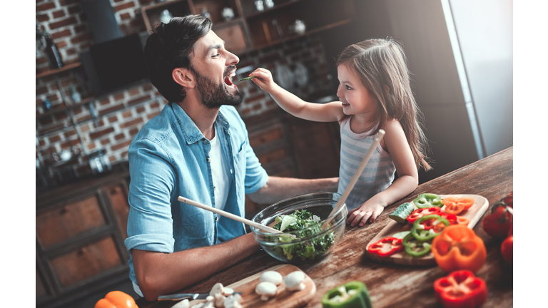 Dad with daughter on kitchen