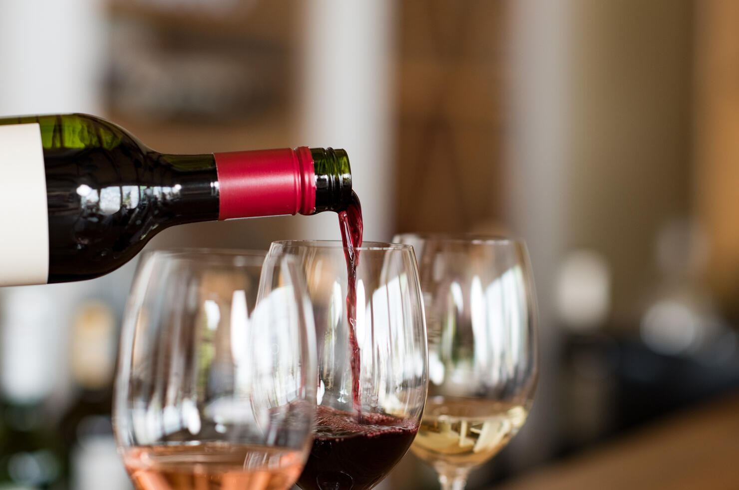 Pouring wine in glasses