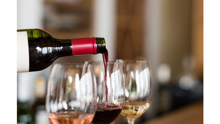 Pouring wine in glasses