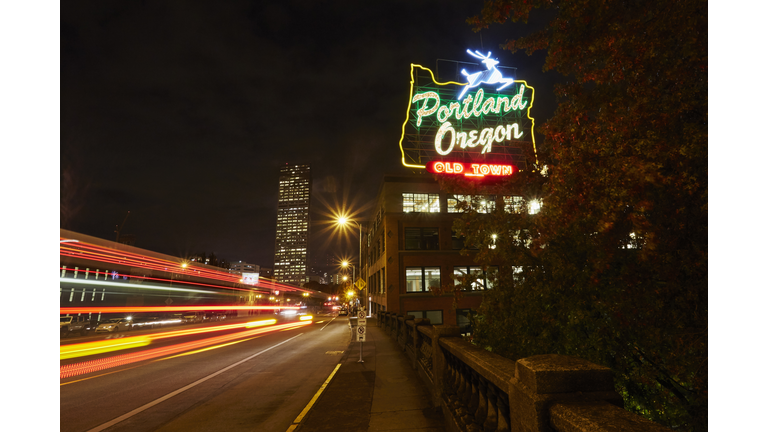 Highway and neon sign at night, Portland, Oregon, USA
