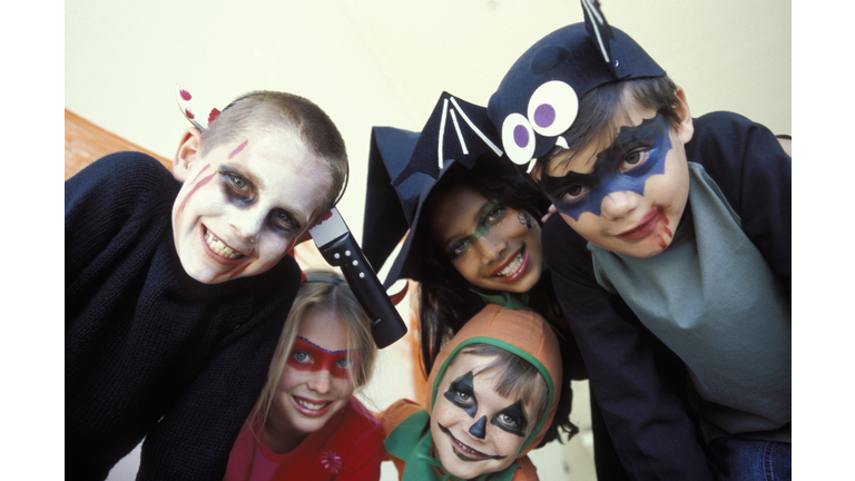 Portrait of children in Halloween costumes