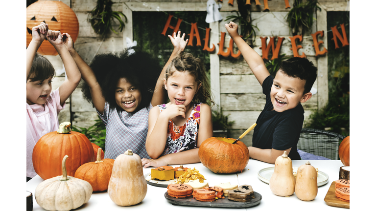 Playful kids enjoying the Halloween festival