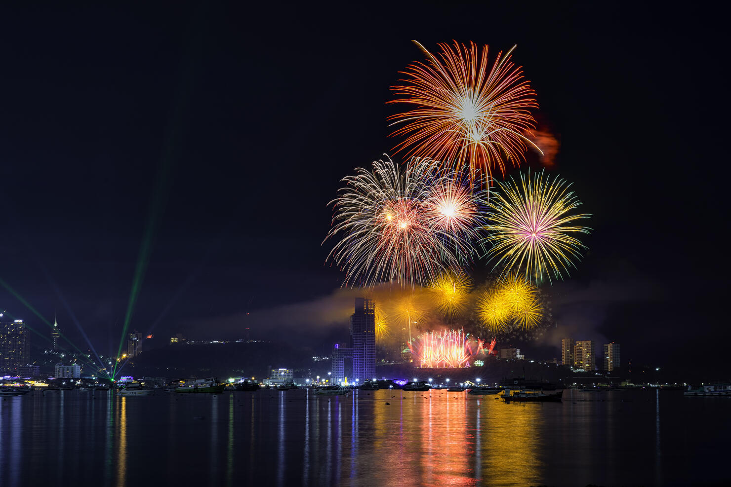 The colorful firework over the Pattaya Beach, Chonburi Thailand