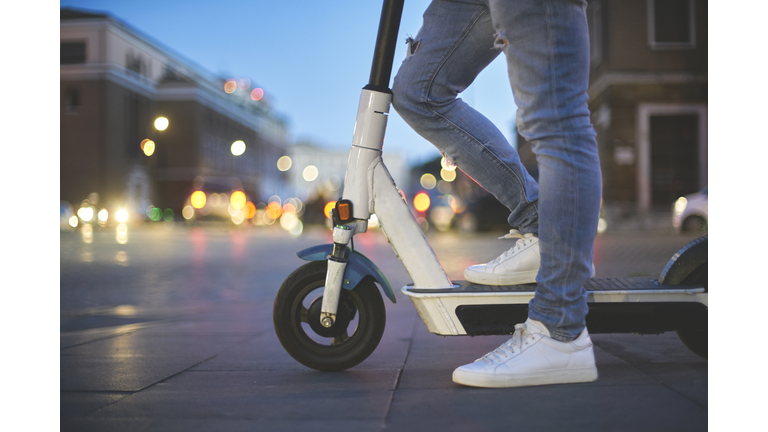 Man using electric push scooter