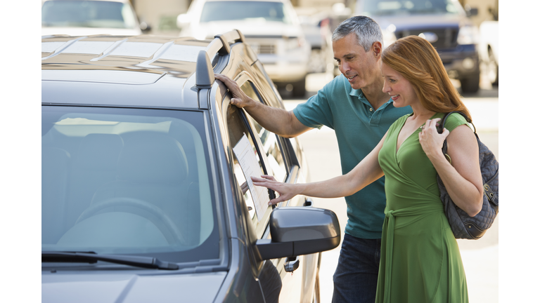 Couple shopping for a new car