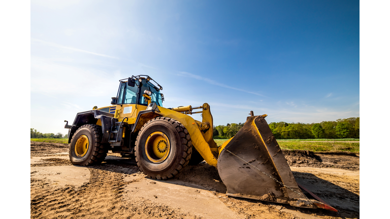 Big wheel loader on a construction site