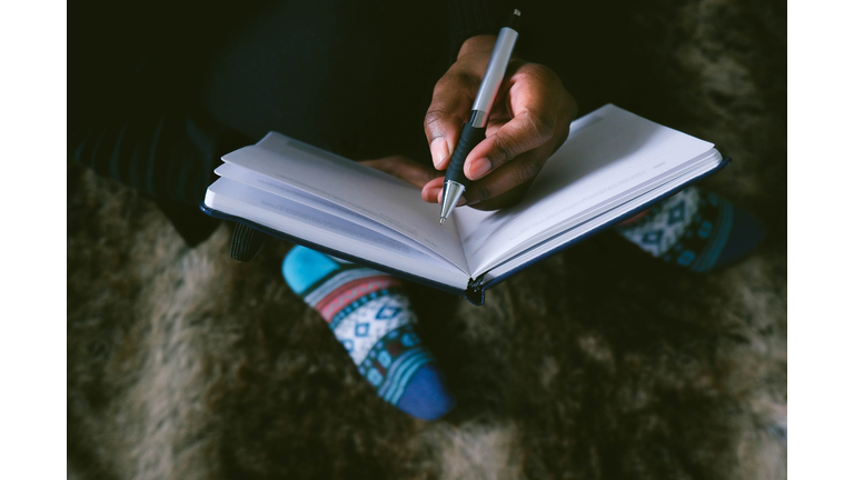 Woman Writes in Journal