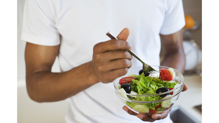 Man eating salad