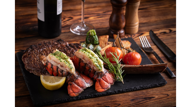 surf and turf with tomahawk rib eye steak and lobster tail