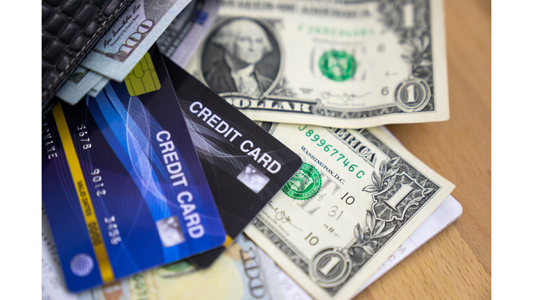 credit card and money, credit card putted on dollars.