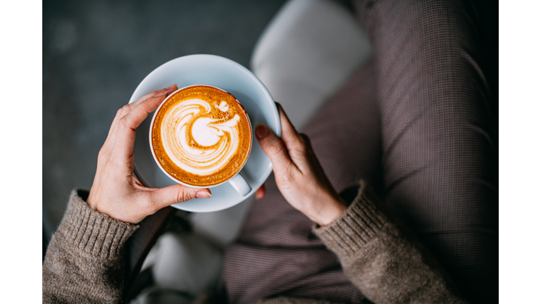 Flat Lay Woman Hand Holding Coffee Latte