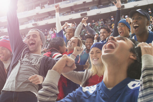 Fans cheering at American football game