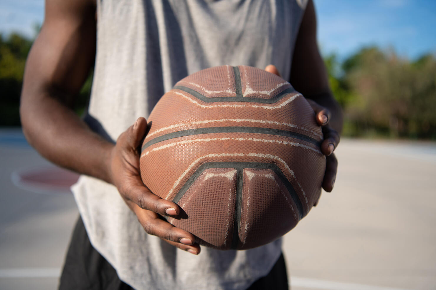 Cropped basketball player with ball