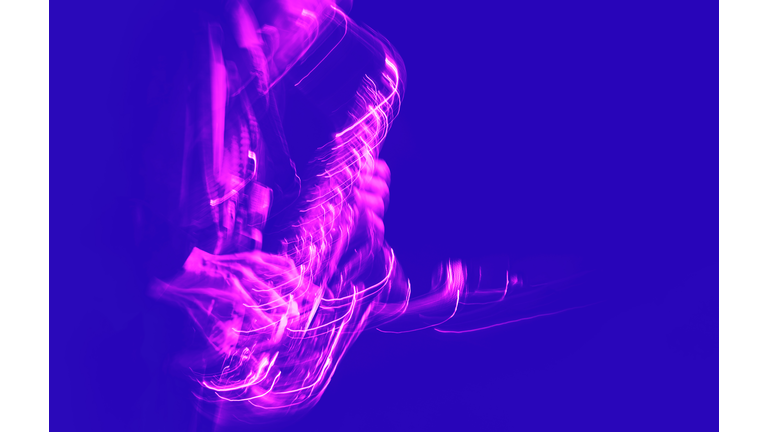 Saxophone player performing on stage