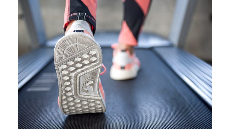 Exercise treadmill cardio running workout at fitness gym of woman taking weight loss with machine aerobic for slim and firm healthy in the morning.