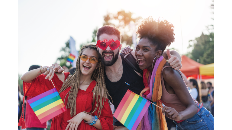 Excited young people meeting at the pride festival