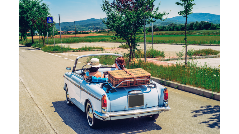 Mature Women on a Road Trip With Old-fashioned Convertible