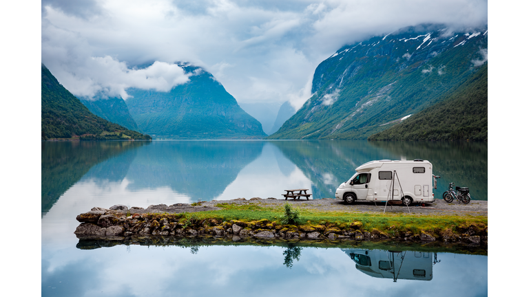 Family vacation travel RV, holiday trip in motorhome, Caravan car Vacation. Beautiful Nature Norway natural landscape.