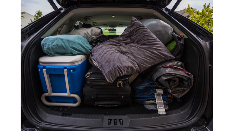 Car truck packed with luggage and other items for road trip