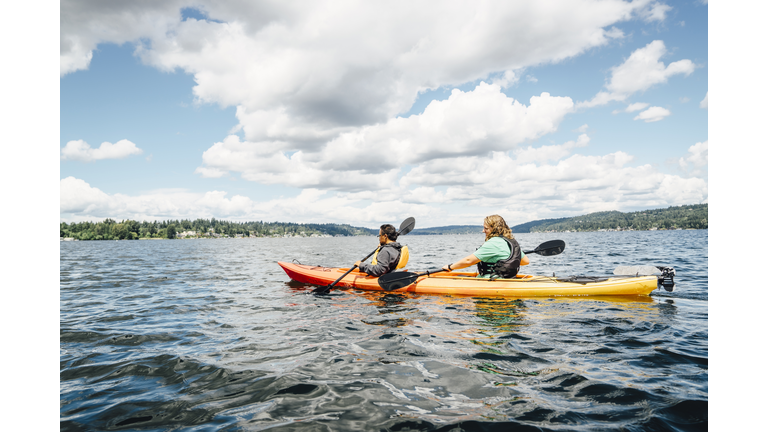 Man and woman paddling kayak