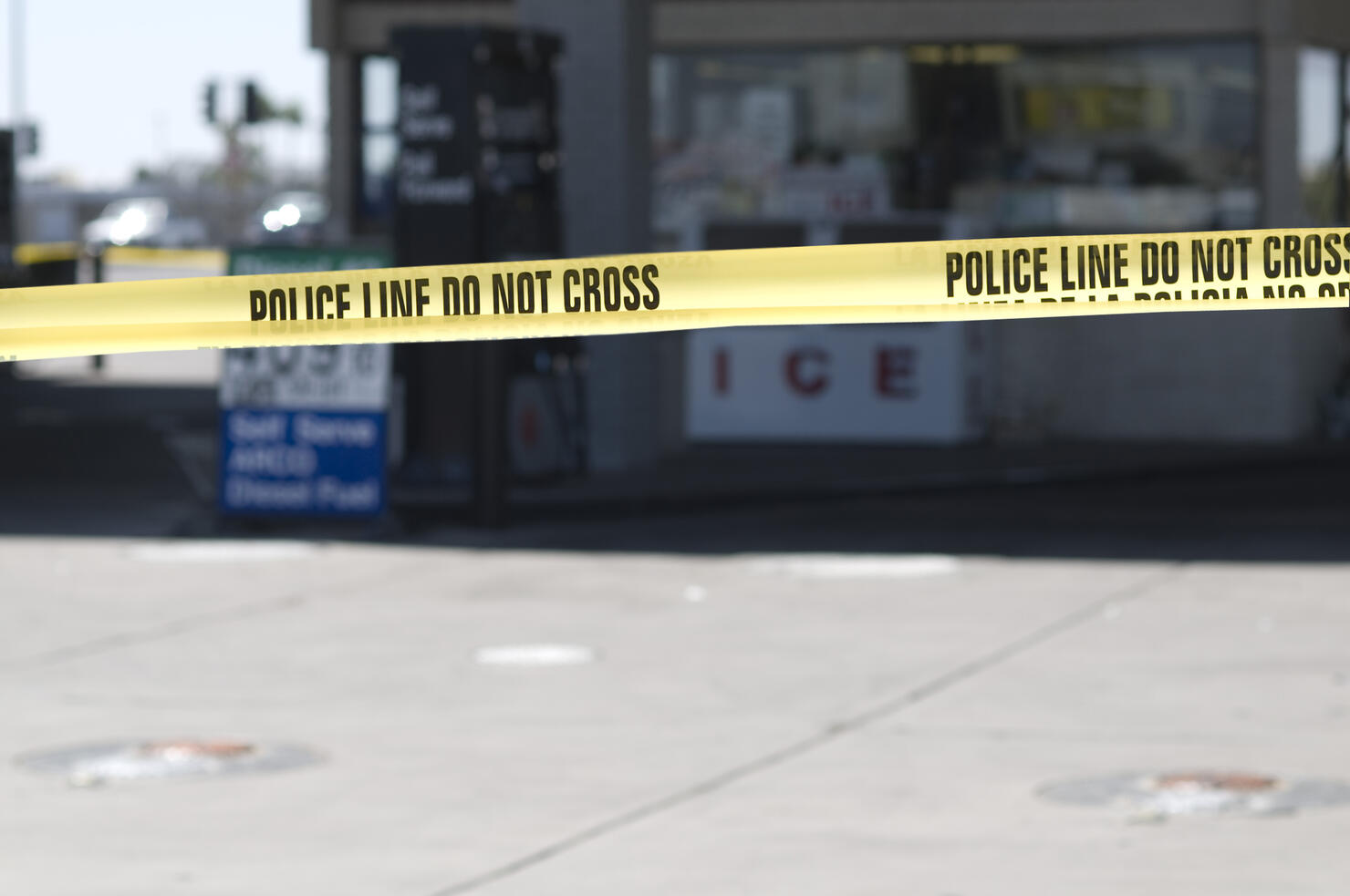 Yellow crime scene tape surronds gas station