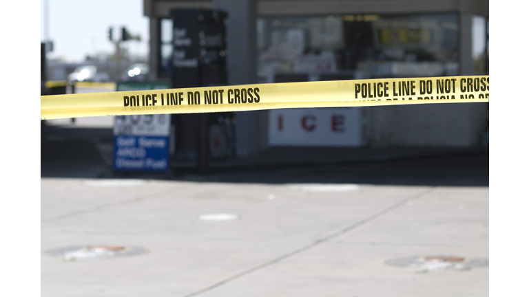 Yellow crime scene tape surronds gas station