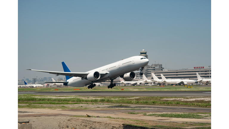 The airplane taking off "A" runaway of Tokyo Haneda International Airport in Tokyo in Japan daytime aerial view from airplane