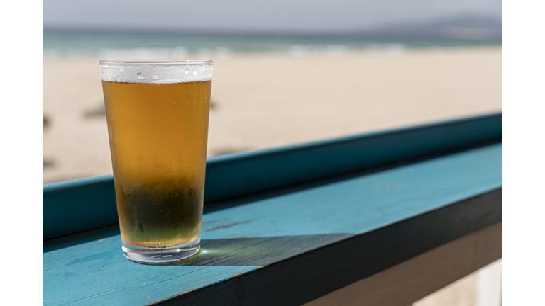 Beer Glass On Table By Beach