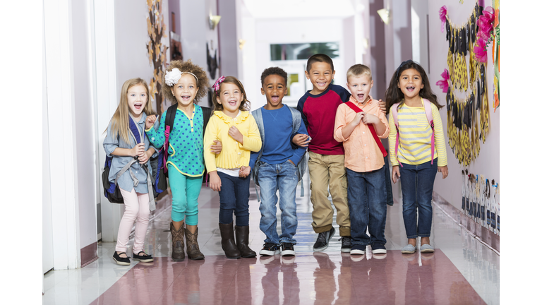 Multiracial group of children in preschool hallway