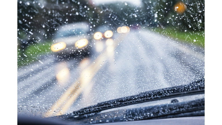 Highway Driver POV Through Raindrop Car Windshield During Rain Storm