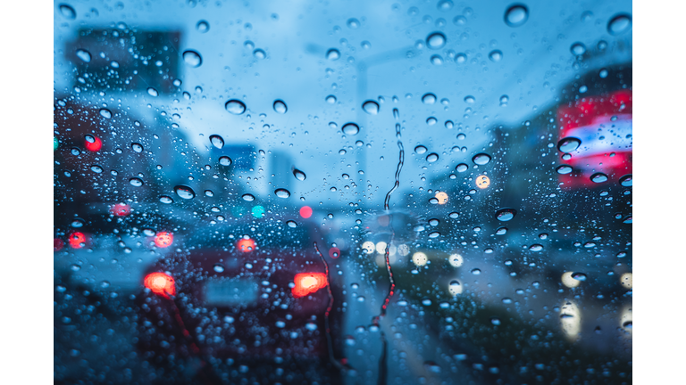 Heavy raining strom when drive at evening blue chill wet windshield