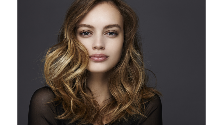 studio shot of a beautiful young woman