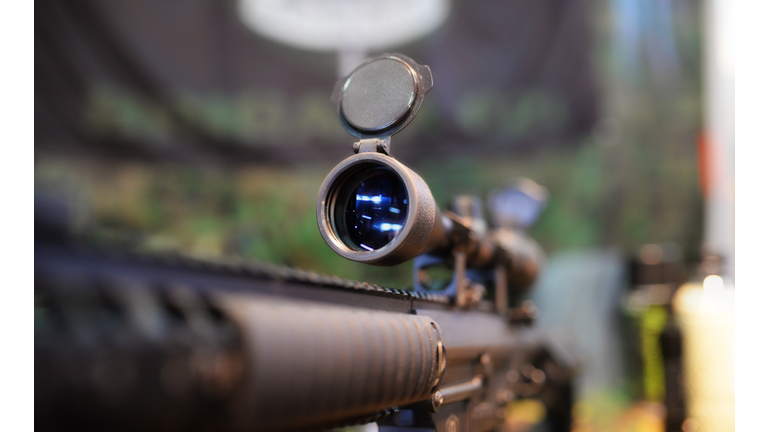 Scoped rifle in army shop