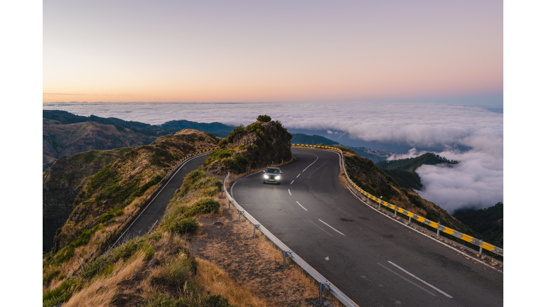Car driving on winding mountain road, Madeira island, Portugal