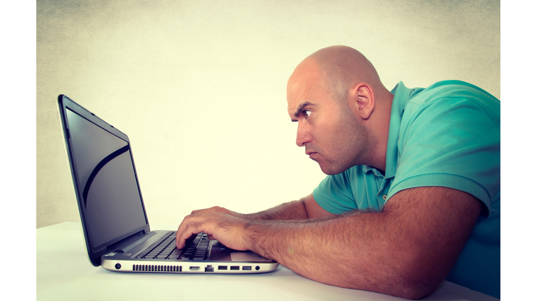 Man looking at laptop computer