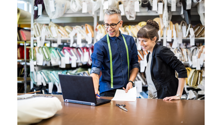 Coworkers working together at fashion industry