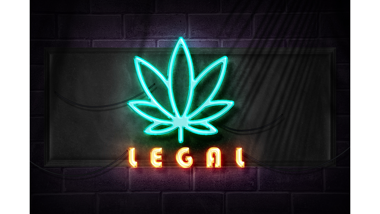 marijuana symbol  with legal text in neon lights