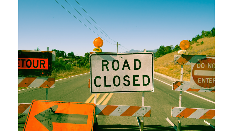Close up row of road closed signs on highway