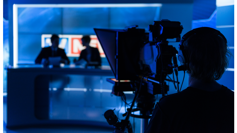 Newsreaders In Television Studio