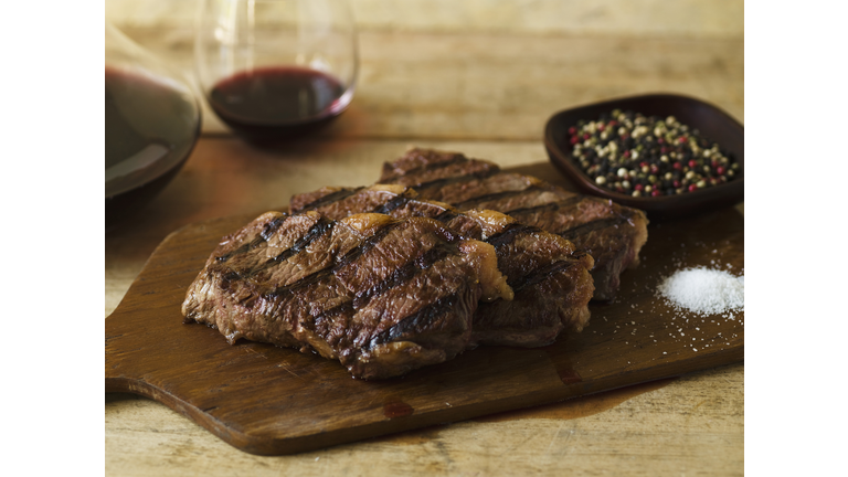 Steak dinner with peppercorn and salt seasonings