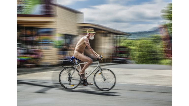 Naked man on bicycle