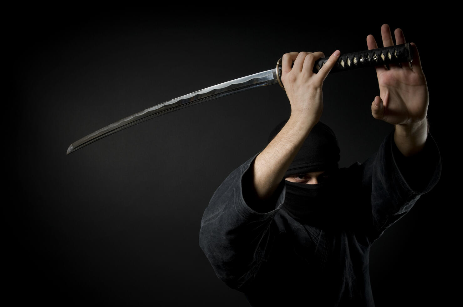Man with katana, black background
