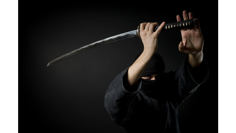 Man with katana, black background