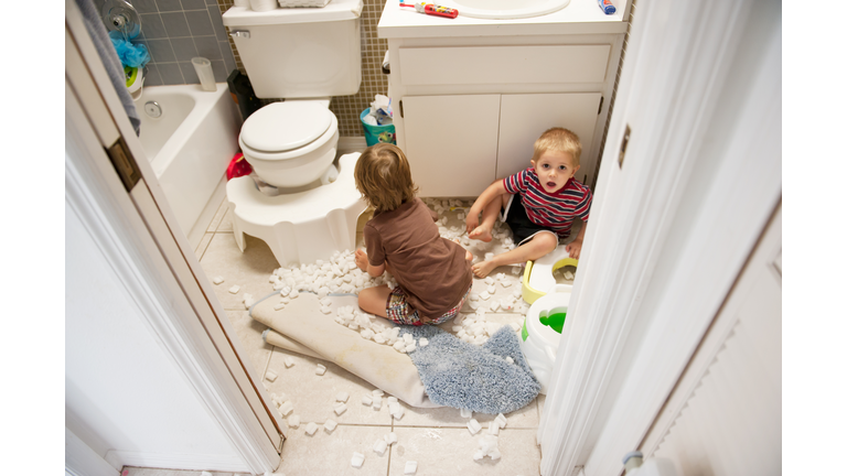 Boys making mess in bathroom